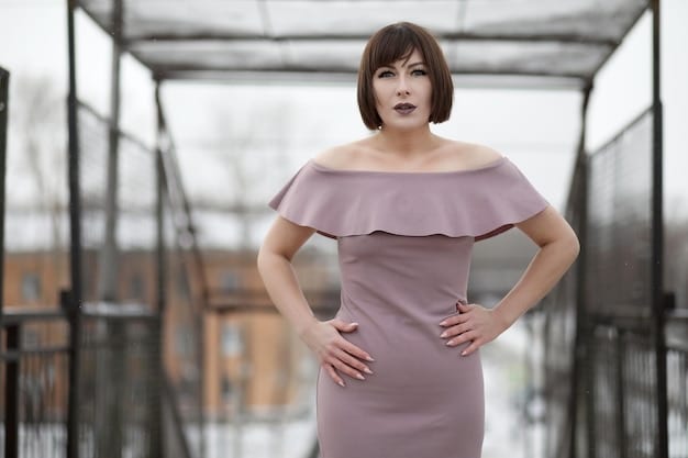 A woman with a rectangle body shape wearing a fit-and-flare dress. The dress cinches at the waist and flares out at the hips, creating the illusion of an hourglass figure. She is accessorized with a statement belt and heels.