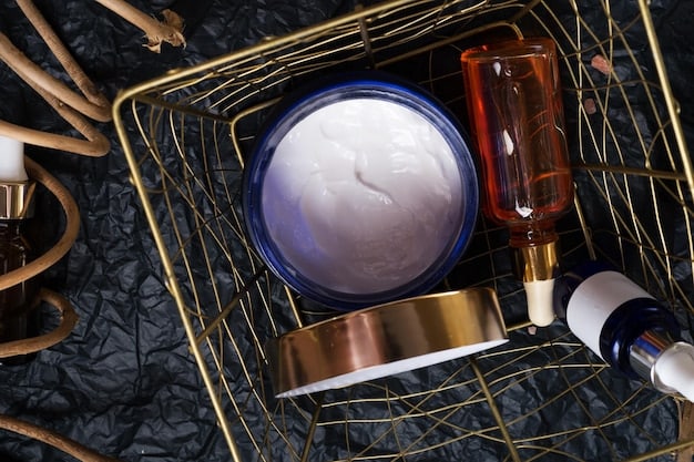 A close-up shot of a variety of men's skincare products arranged on a clean surface, including cleanser, serum, moisturizer, and eye cream. The products are in sleek, modern packaging.