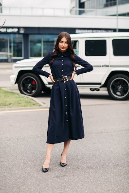 A woman wearing a simple black midi dress, first accessorized with a blazer and flats in an office setting, and then transformed with statement jewelry, heels, and a clutch for an evening look. The image is split to show the before and after transformation.