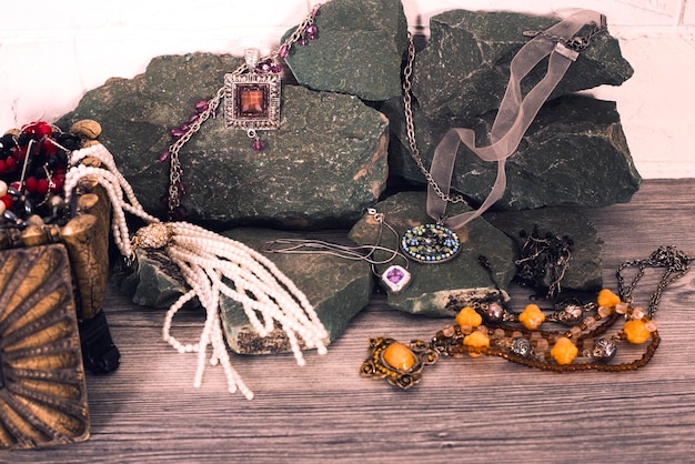 A close-up shot of various pieces of jewelry, including necklaces, earrings, bracelets, and rings, showcasing different styles and materials.