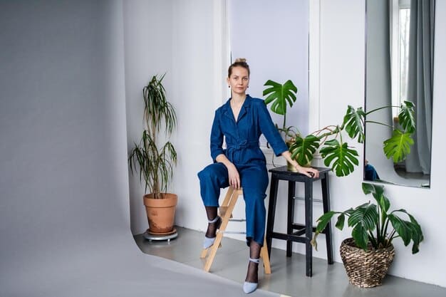 A woman wearing a royal blue power suit with a crisp white blouse and nude heels, showcasing a bold and confident look. The background is a modern office space with minimalist decor.