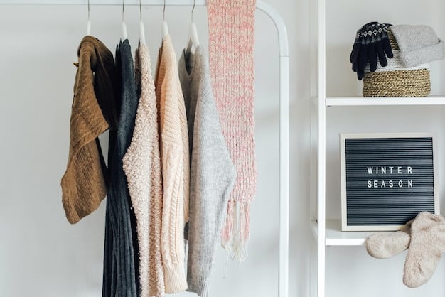 A minimalist wardrobe featuring a curated selection of clothing items hung neatly on a rack. The collection includes neutral-colored basics such as a white t-shirt, a black blazer, denim jeans, a beige sweater, and a linen dress. The aesthetic is clean, organized, and promotes the concept of a capsule wardrobe with versatile, timeless pieces for sustainable style.