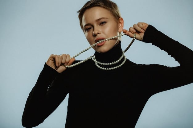A close-up shot of a woman wearing a delicate pearl necklace and a black dress, showcasing the elegance of classic date night accessories. The soft lighting accentuates the texture of the pearls and the sheen of the dress.