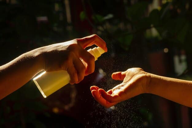 A close-up shot of a hand delicately spraying a light, sophisticated fragrance onto the wrist. The background is blurred, emphasizing the focus on the act of applying the scent.