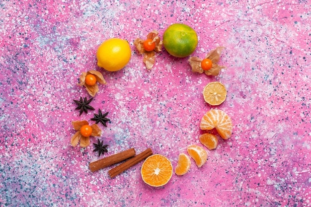 A visually appealing arrangement of various perfume ingredients such as citrus fruits, rose petals, spices, and wood chips, laid out on a wooden surface. The image conveys the diverse palette of scents that make up a fragrance.