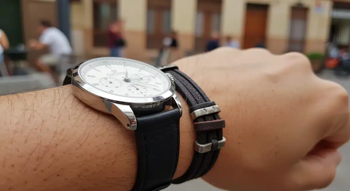 Close-up of a man's wrist with leather bracelet and watch