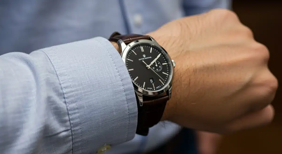 Close-up of modern man's watch and shirt cuff