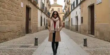 Woman in stylish winter outfit walking a Spanish street