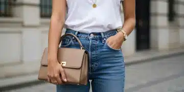 Woman elevating simple outfit with bold necklace and structured bag