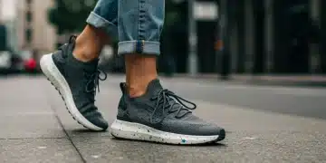 Woman wearing sustainable futuristic sneakers on urban street in 2026